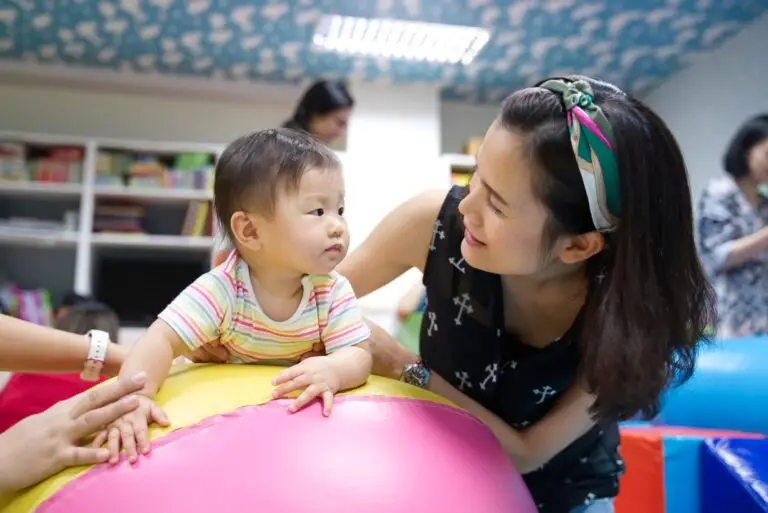 Little young kid learning in play and learn class with her mother. Little young kid learning in play and learn class with her mother.